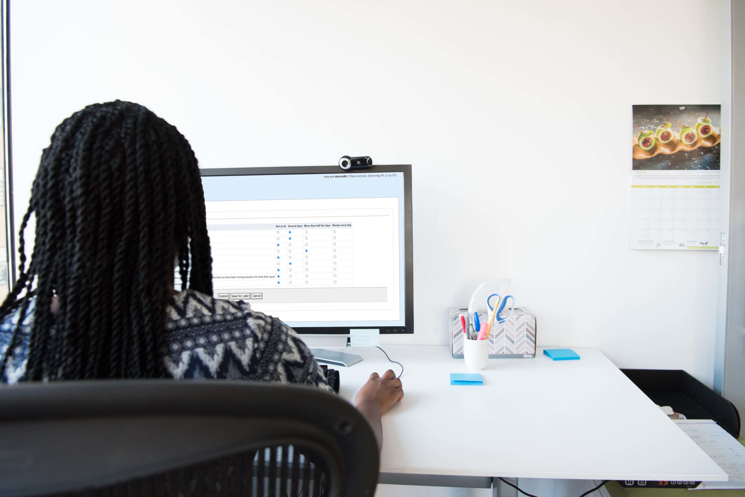 woman filling out digital intake form